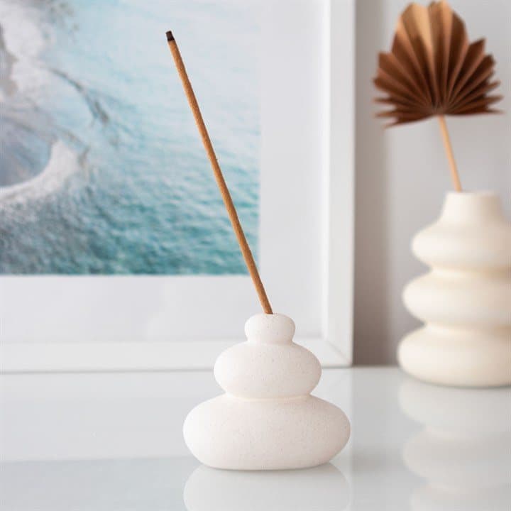Cream speckle incense stick holder with a balancing stones design
