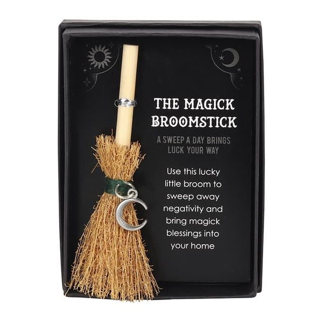 Mini grass broomstick with a silver tone crescent moon charm