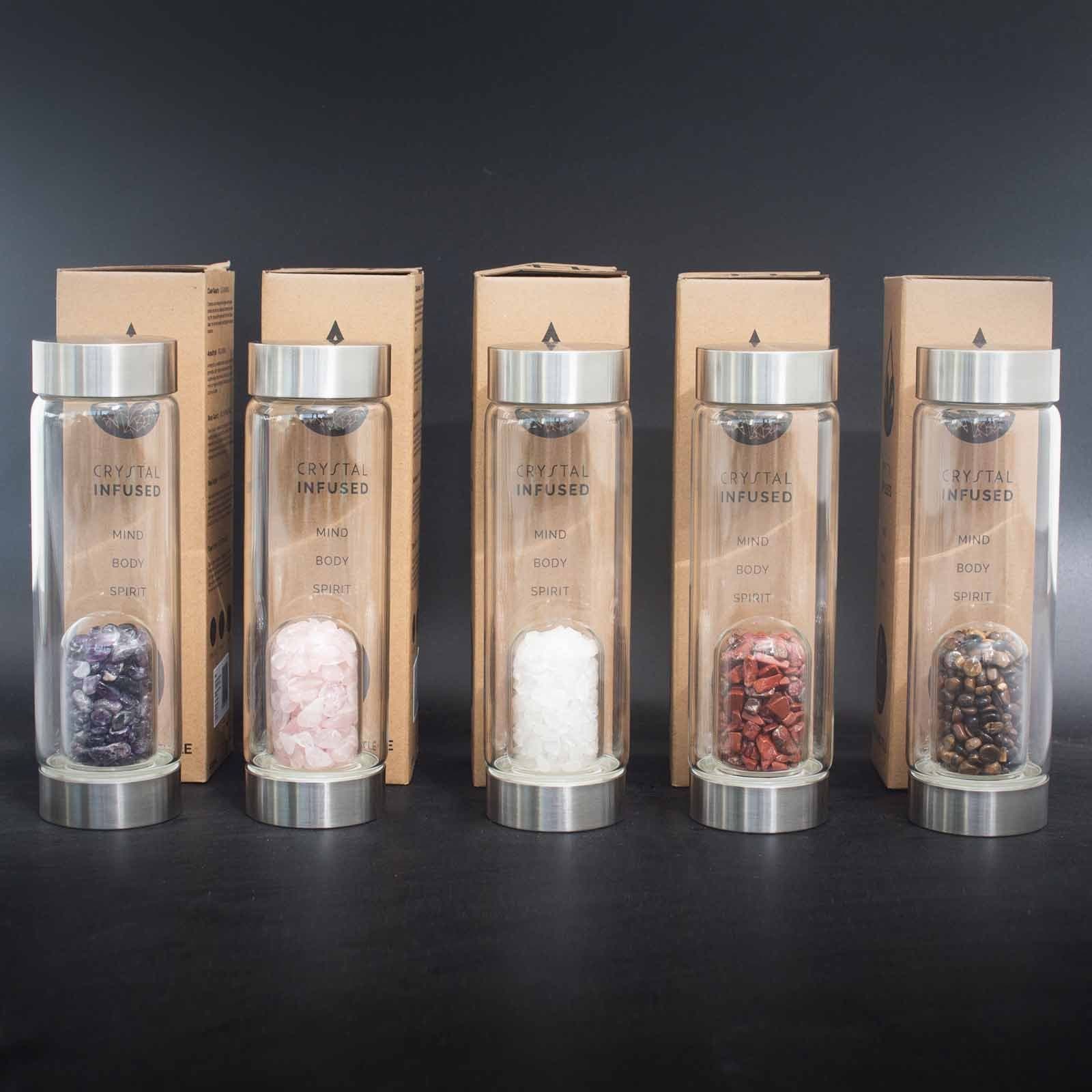 Glass water bottle with clear quartz chips