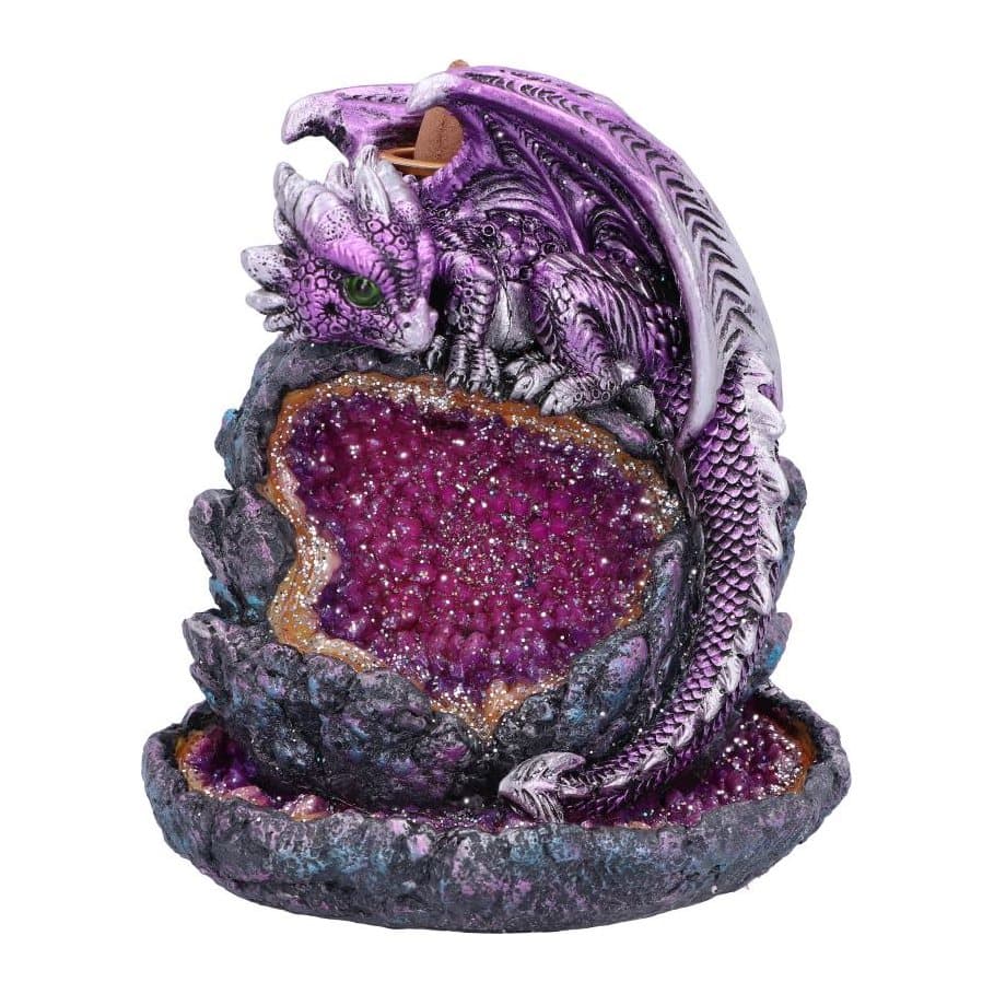 Resin dragon climbing over a split purple geode with crystals