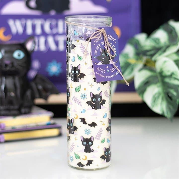 Lavender tube candle with an all-over print of black cats
