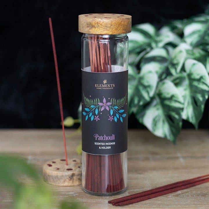 Dark forest patchouli incense tube with wooden lid and floral design