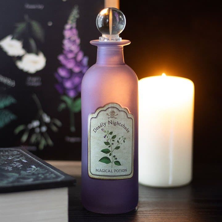 Glass potion bottle with a deadly nightshade design