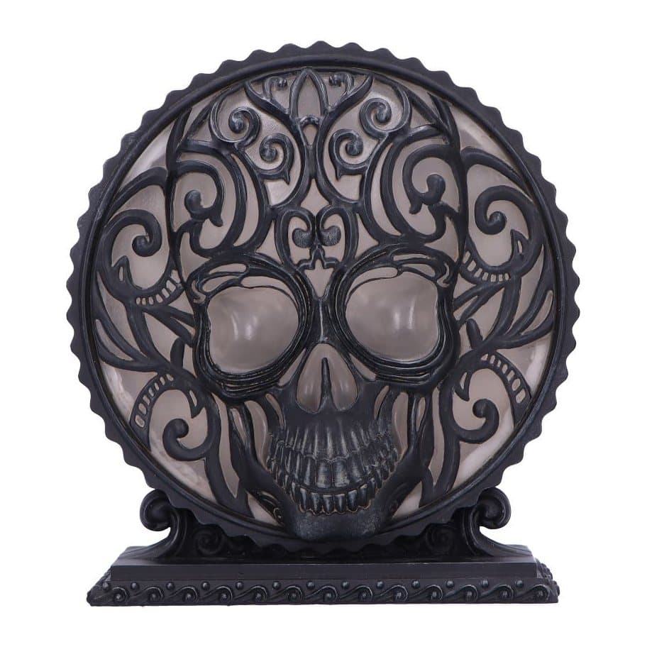 Gothic lamp with a sculpted skull centrepiece and a soft glow