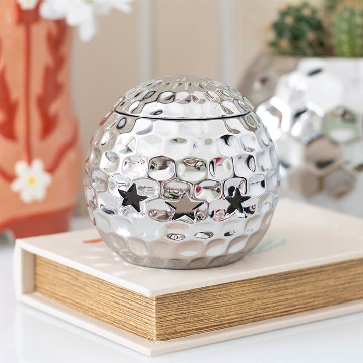 Disco ball shaped oil burner in silver or pink