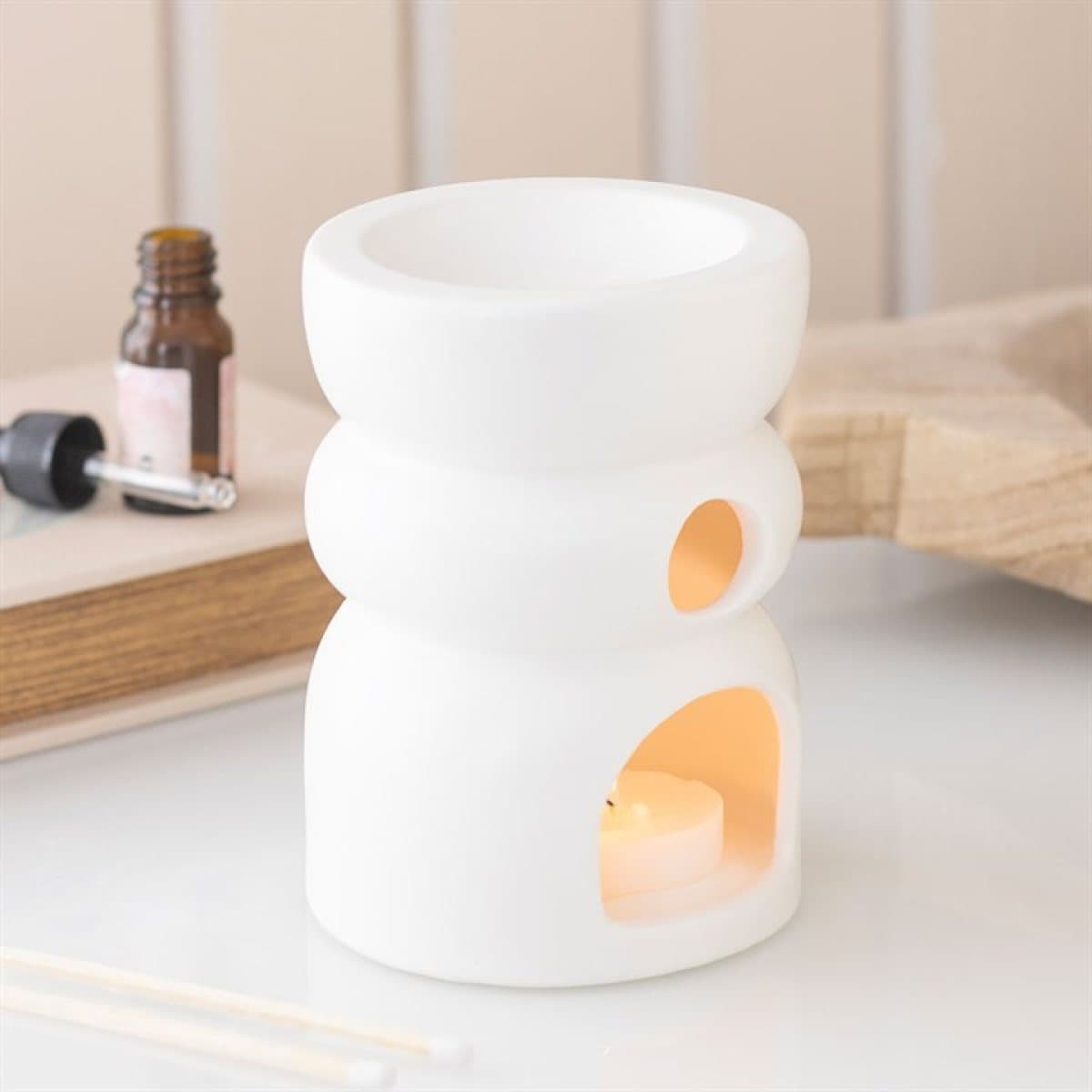 Ceramic oil burner and wax warmer in a double bubble shape