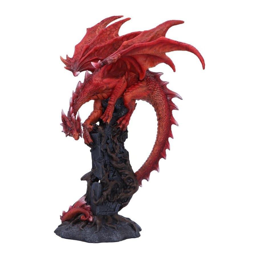 Red resin dragon with wings spread on a stone pillar with tree roots