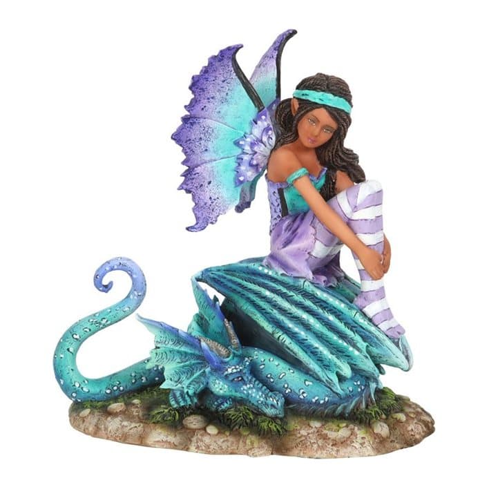 Purple and teal fairy figurine sitting on top of her dragon