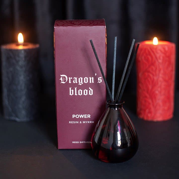 Dark red glass dragon's blood reed diffuser labelled Power