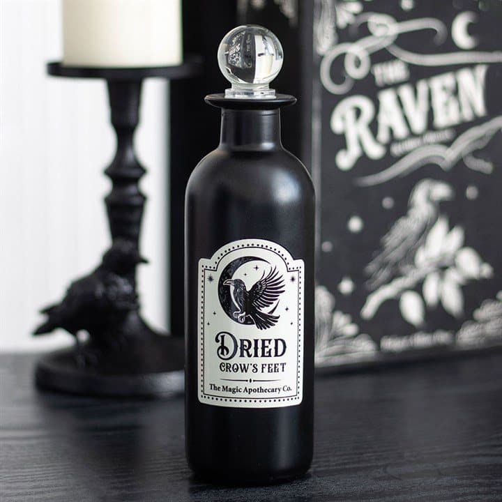 Glass potion bottle with a Dried Crow's Feet label