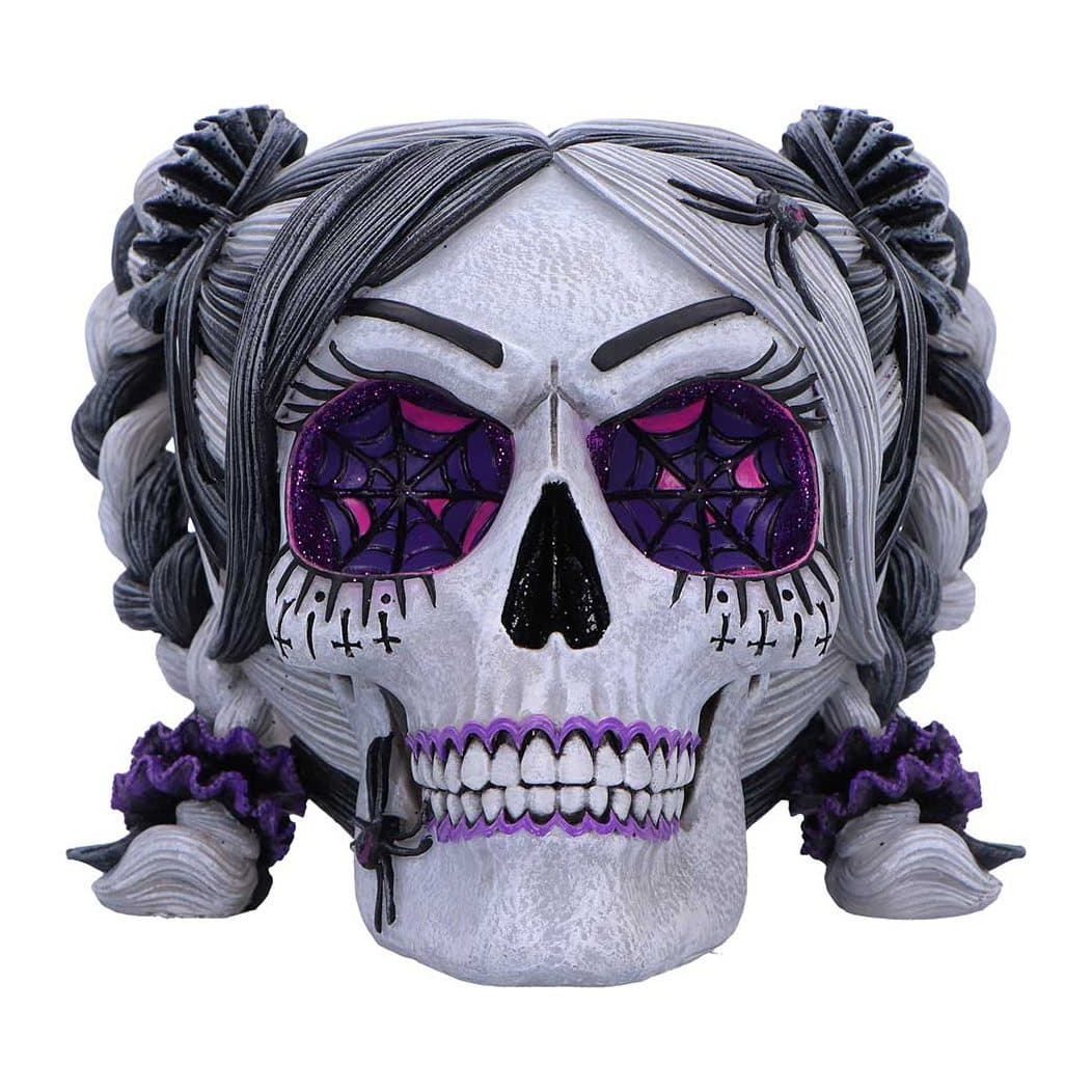 Black and grey skull figurine with pink and purple accents and glitter eye sockets