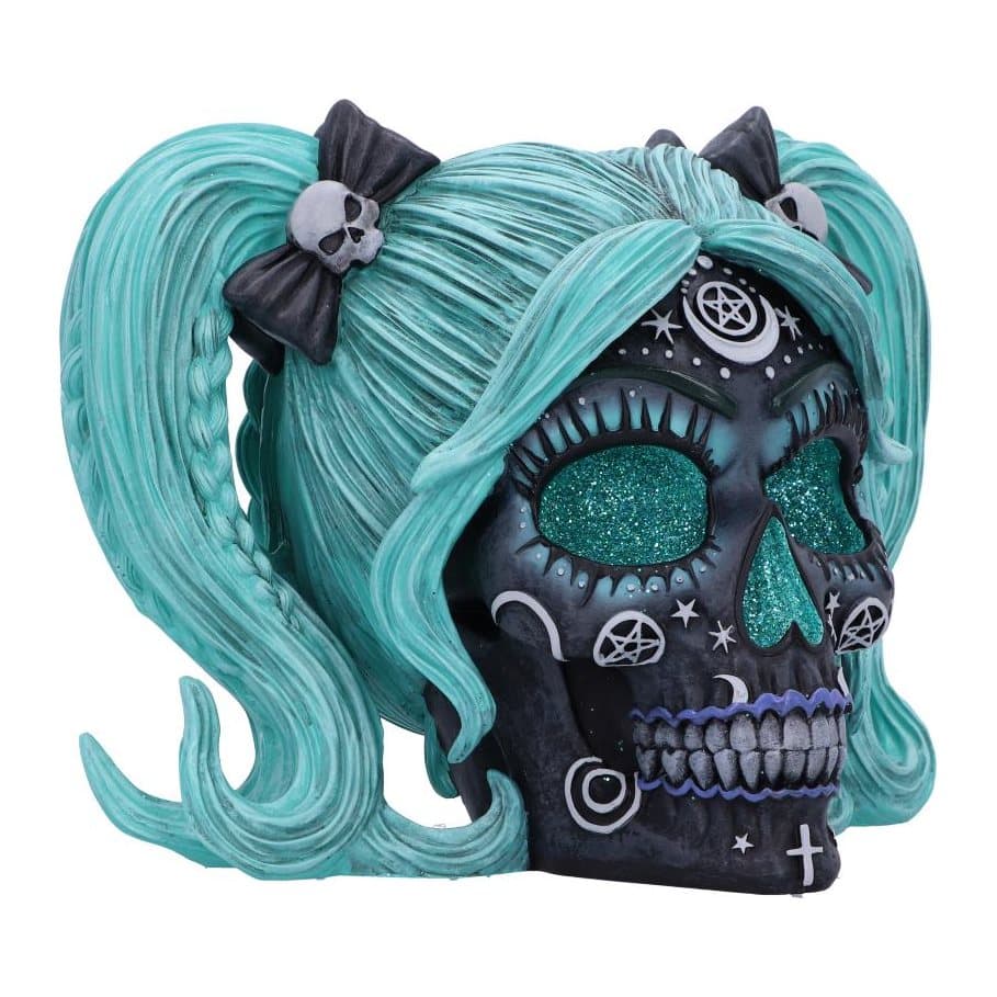 Resin skull with turquoise features and witchy patterns