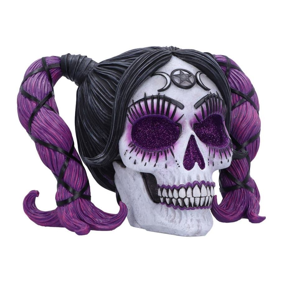 Resin skull hand-painted with purple features and voodoo patterns