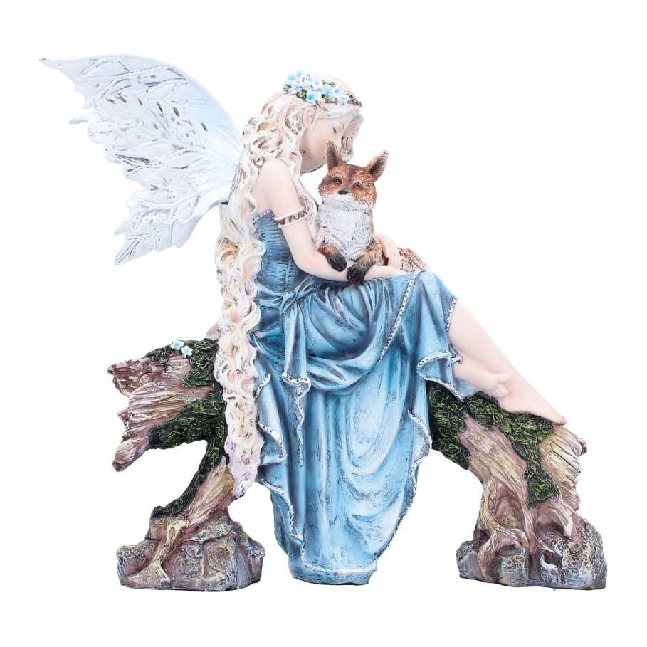 Resin fairy in a blue dress sitting on a log with a fox on her lap