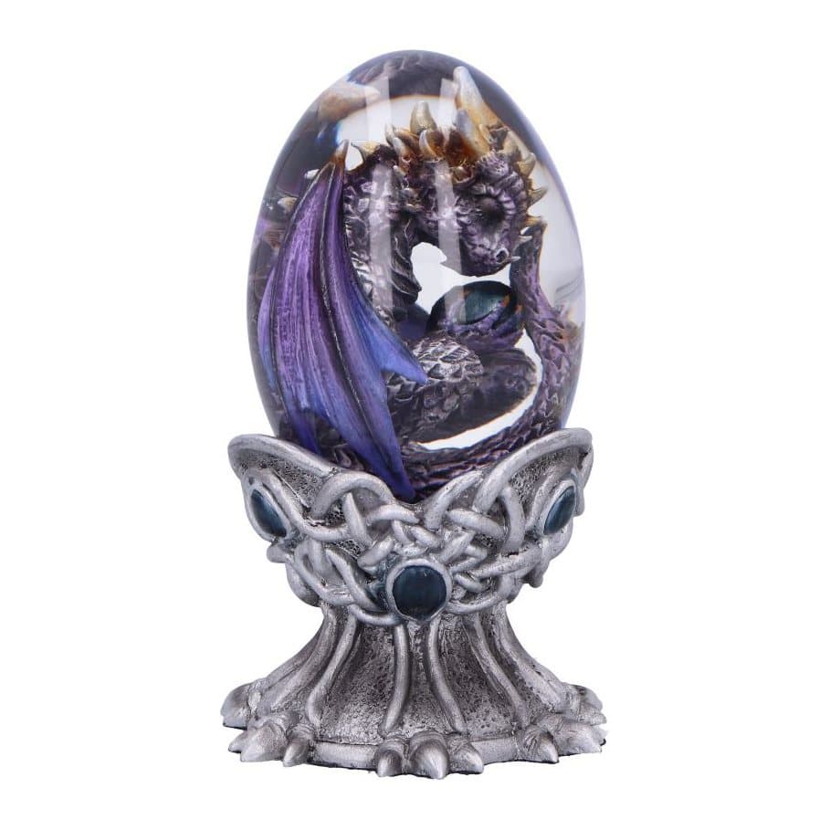 Silver dragon with purple wings inside a clear egg on an ornate silver stand
