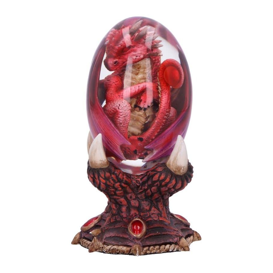 Red resin dragon inside a clear egg on a red and bronze stand