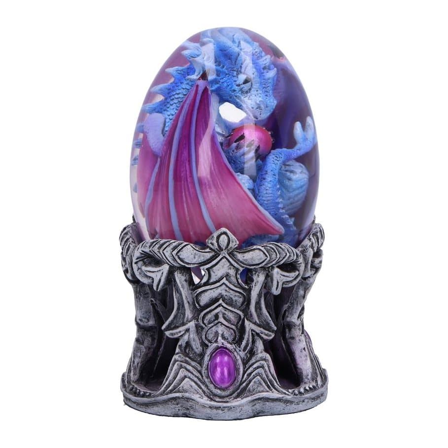 Blue dragon with purple wings inside a clear egg on a silver and purple stand