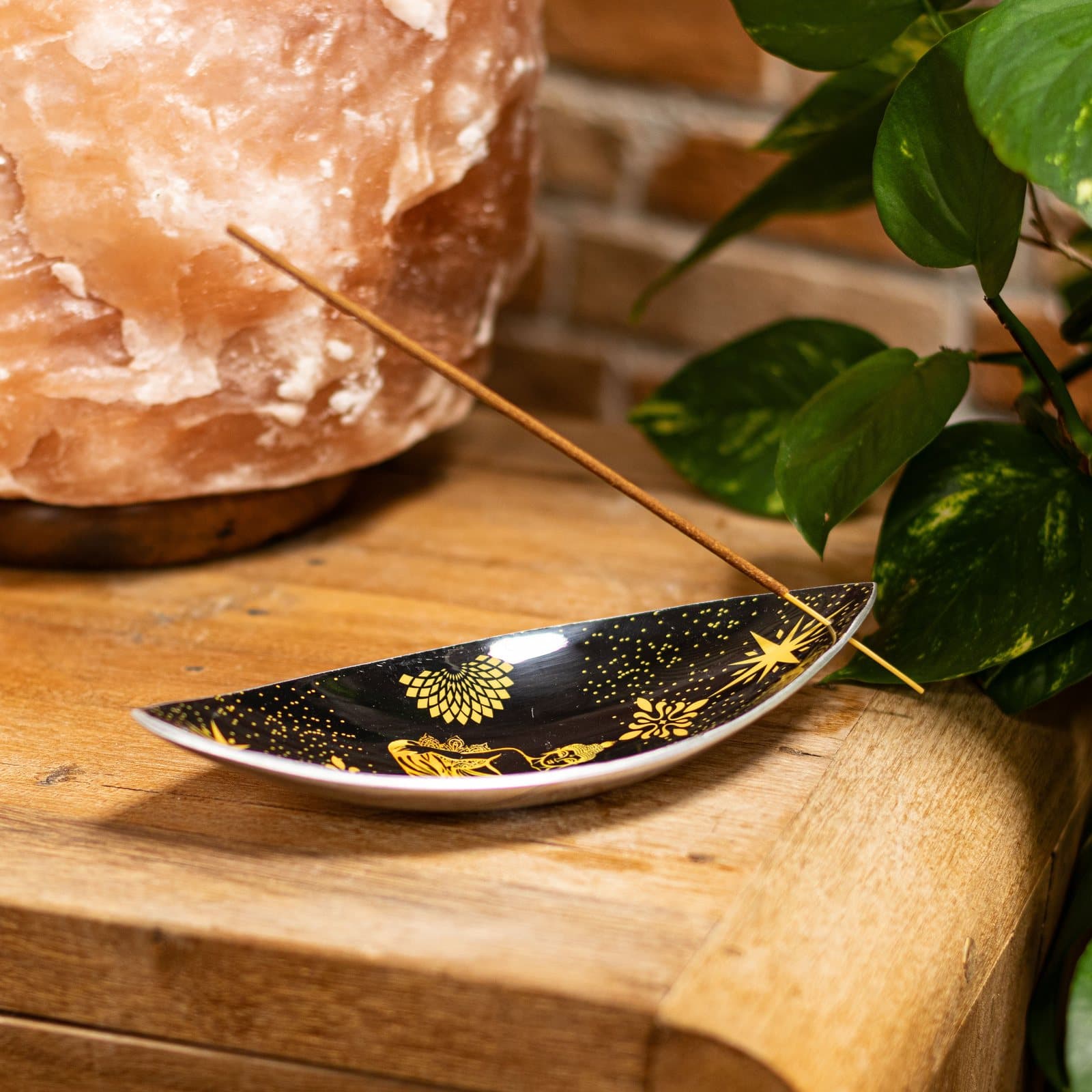 Black enamel incense bowl with gold Buddha artwork