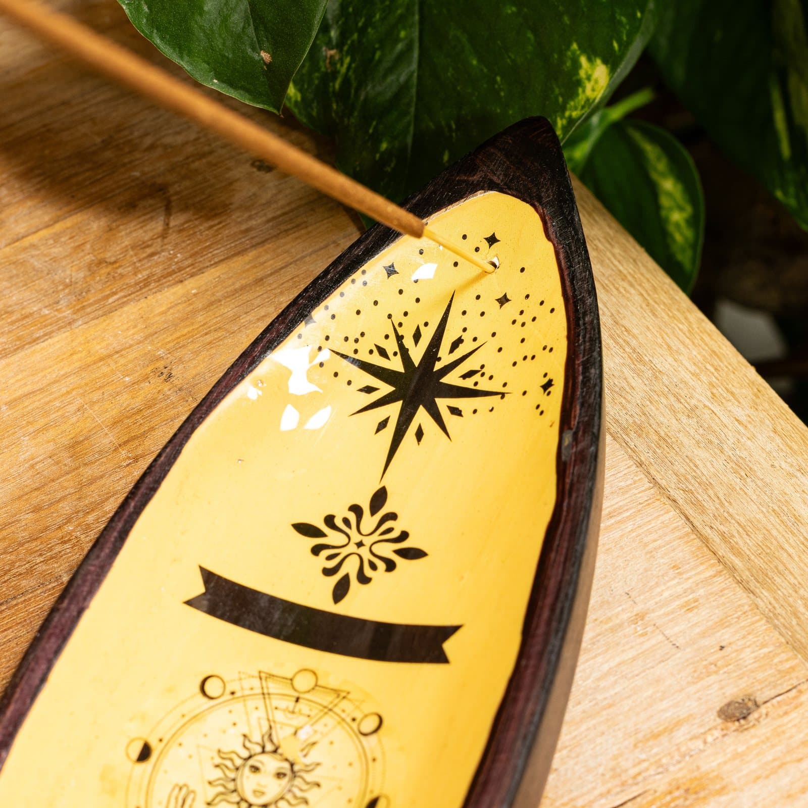 Long enamel and mango wood incense bowl with golden hand and sun design