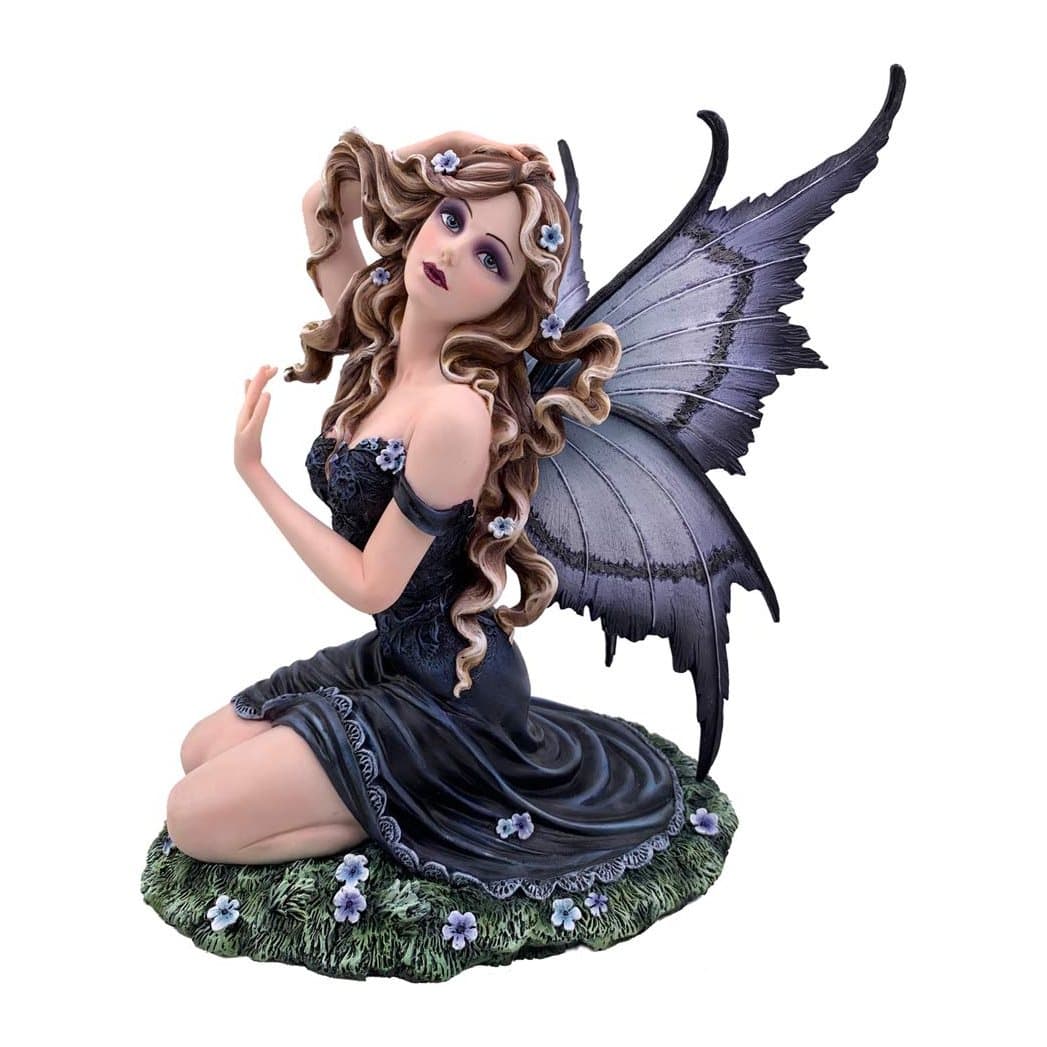 Kneeling resin fairy with lilac butterfly wings on a grass-textured base