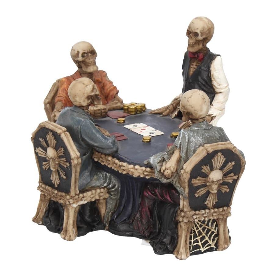 Resin skeletons playing poker around a gothic table