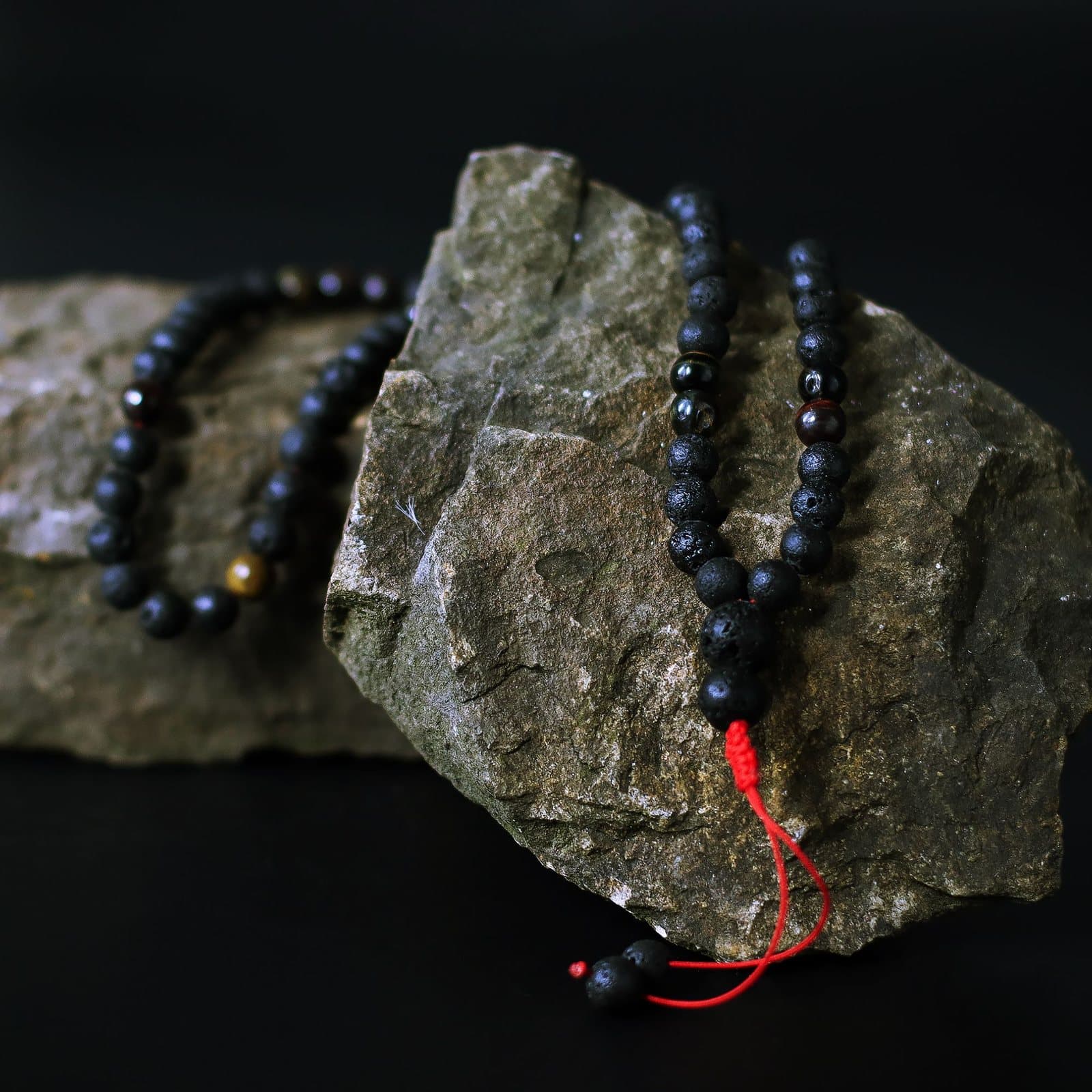 Lava stone and Tiger's Eye bead necklace on a red cord