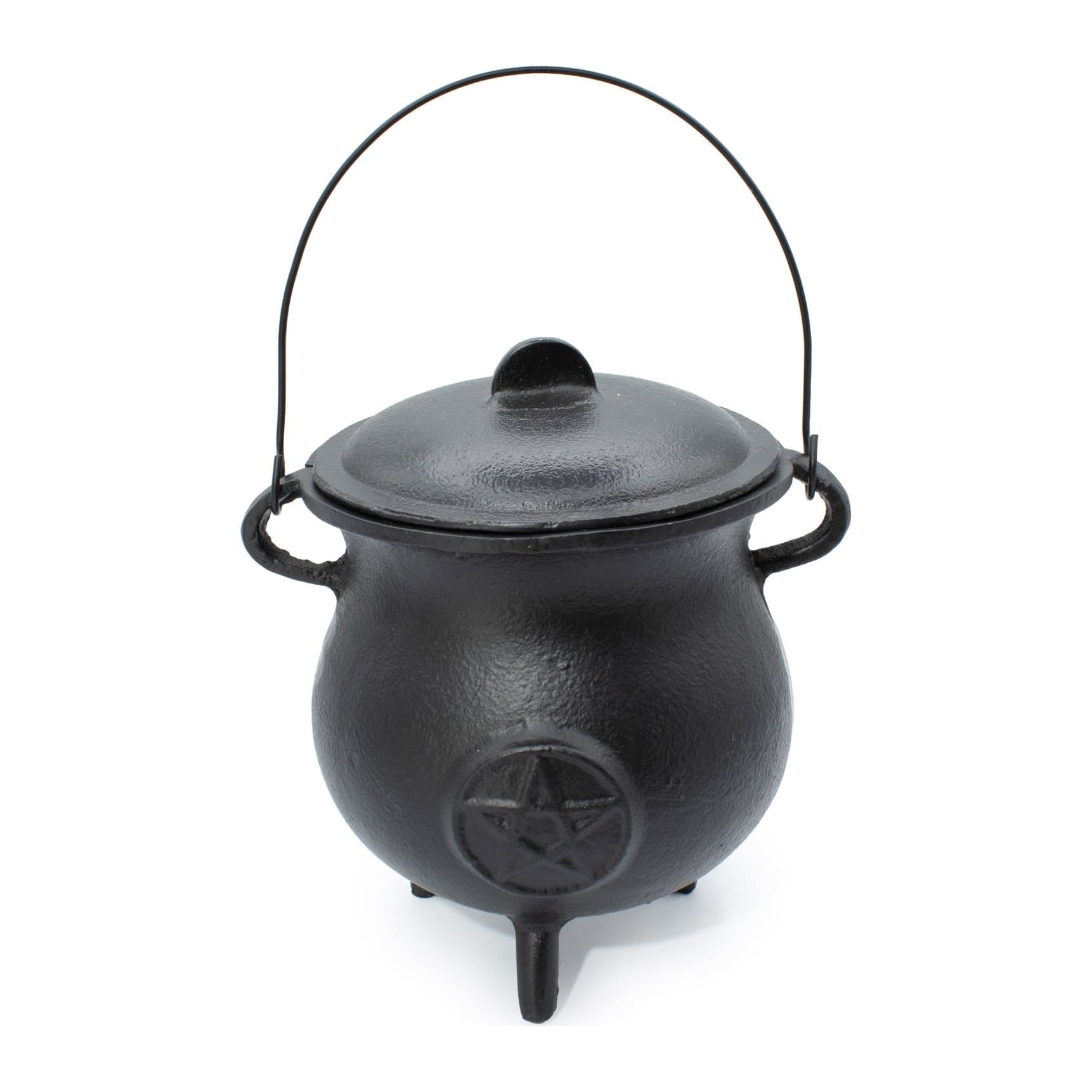 Large cast iron cauldron with a pentagram detail, lid, handle and three legs