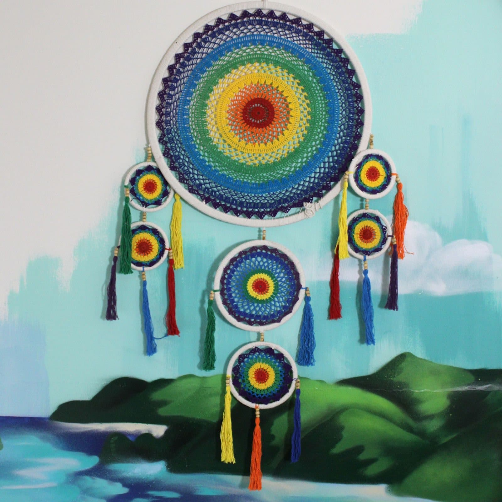 Rainbow bamboo and cotton dreamcatcher inspired by a Bali temple umbrella