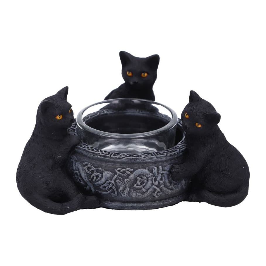 Three black cats with yellow eyes around a decorated tea light holder