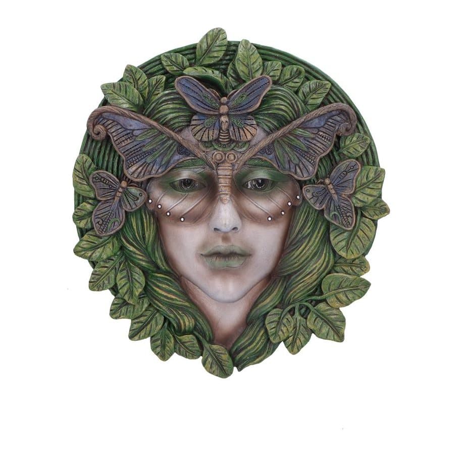 Wall plaque of a woman's face with green foliage and butterfly wings