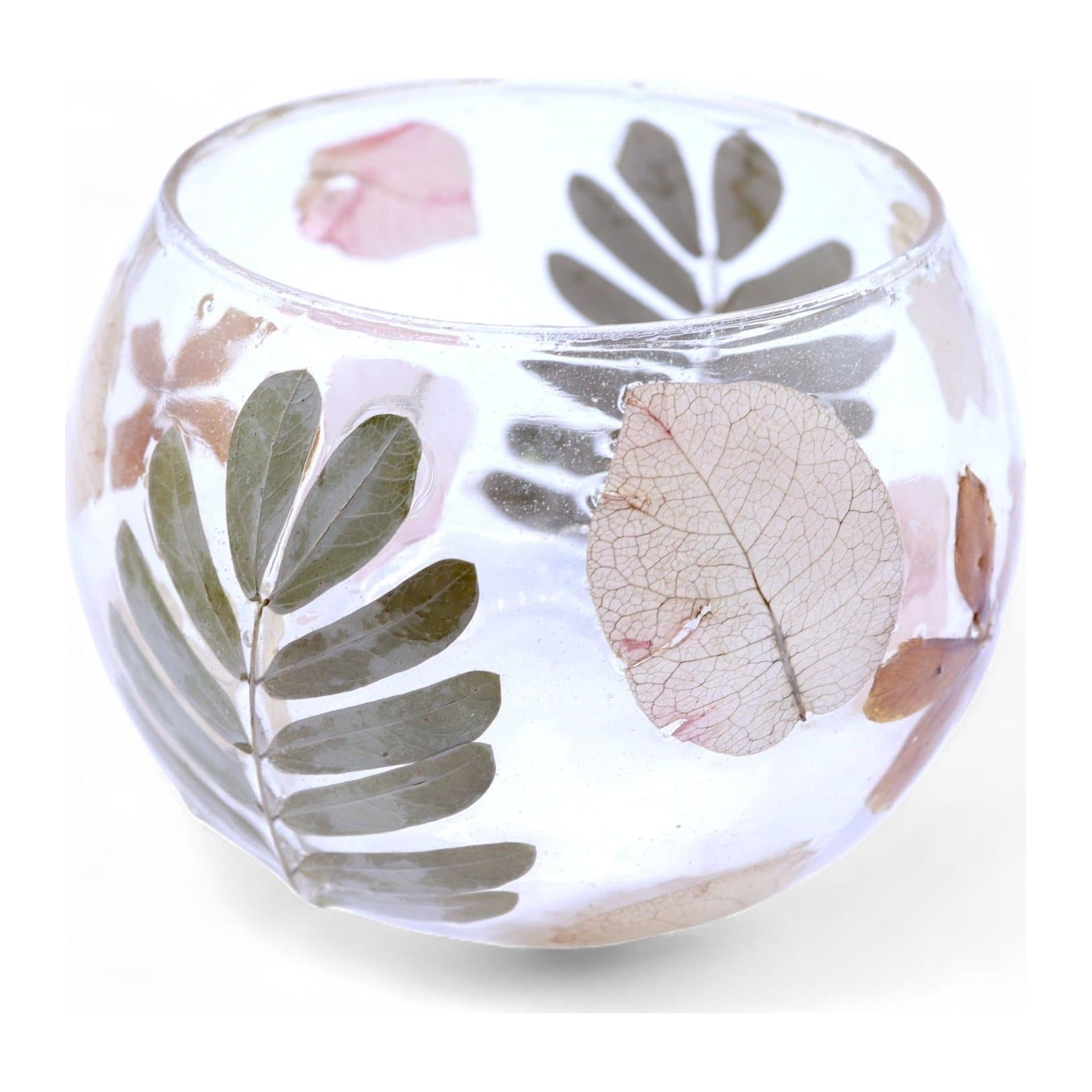 Bowl-shaped recycled glass candle holder with pressed leaves and blossoms in the glass