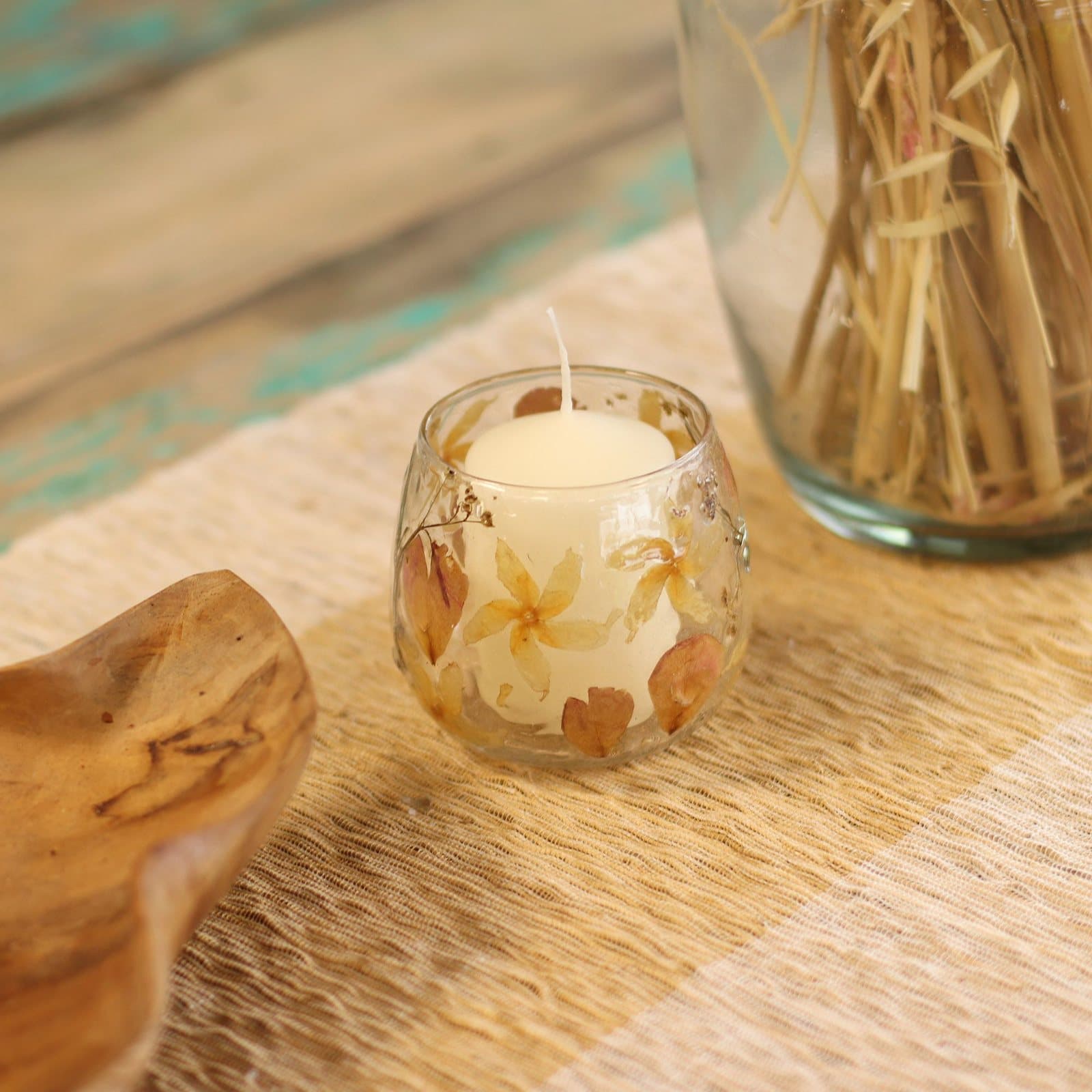 Straight glass candle holder with pink and cream pressed flowers set in the glass