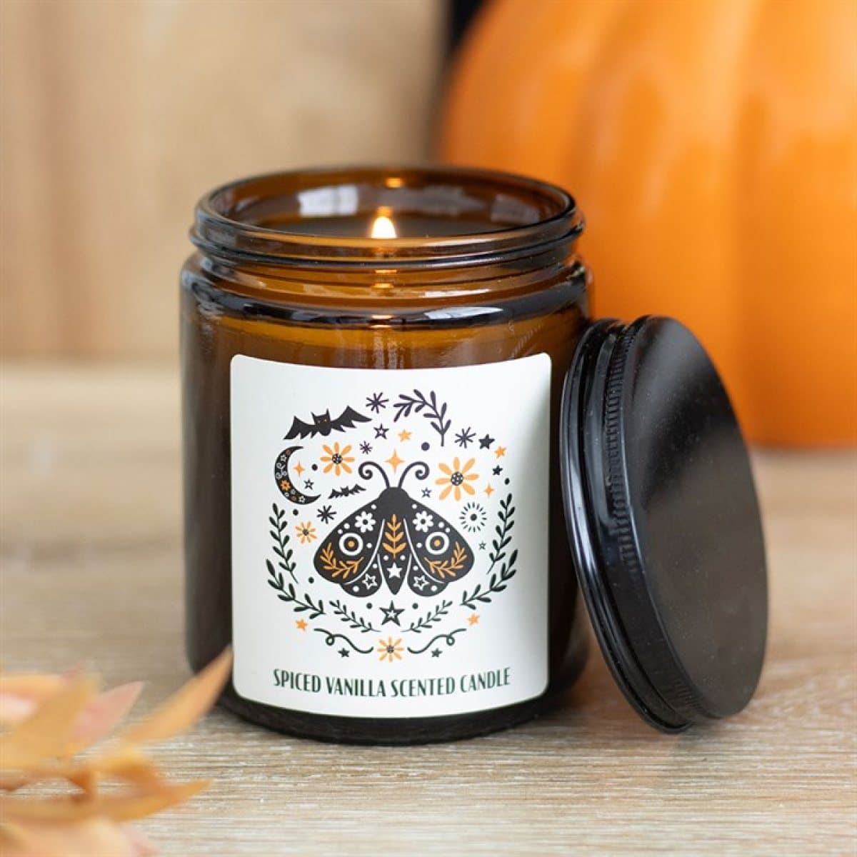Moth design spiced vanilla candle in a brown apothecary-style jar
