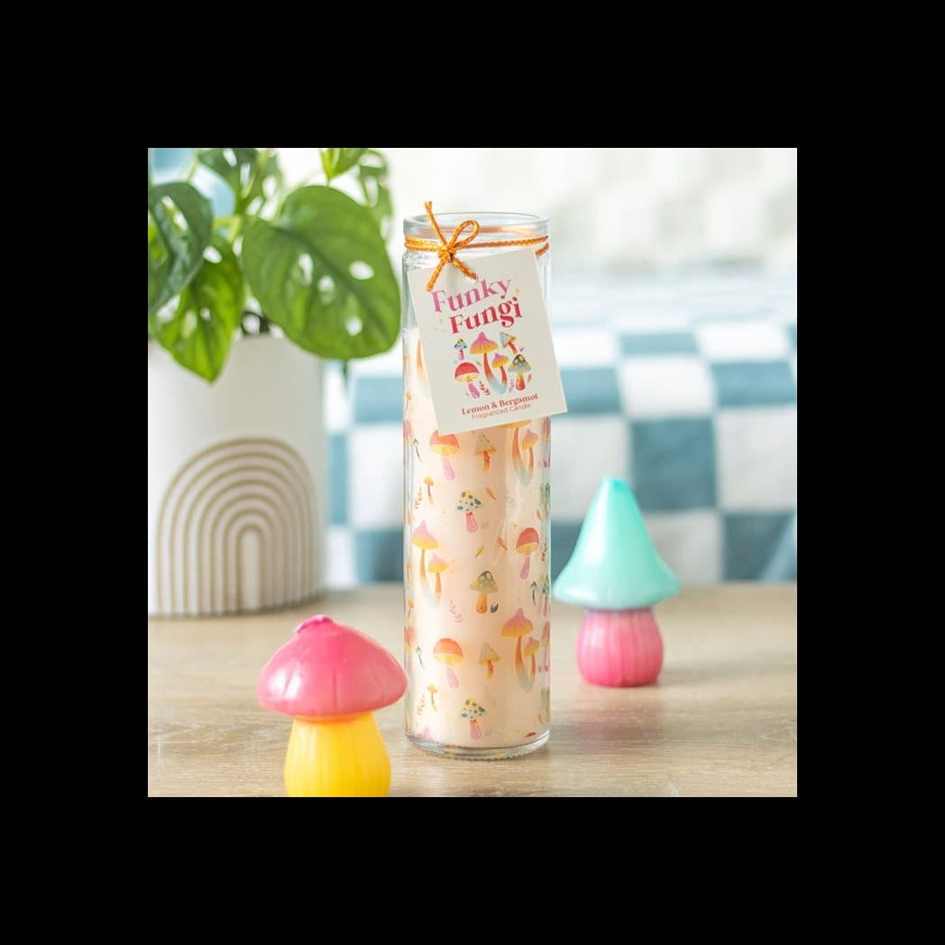 Tube candle in a glass jar with a colourful mushroom design