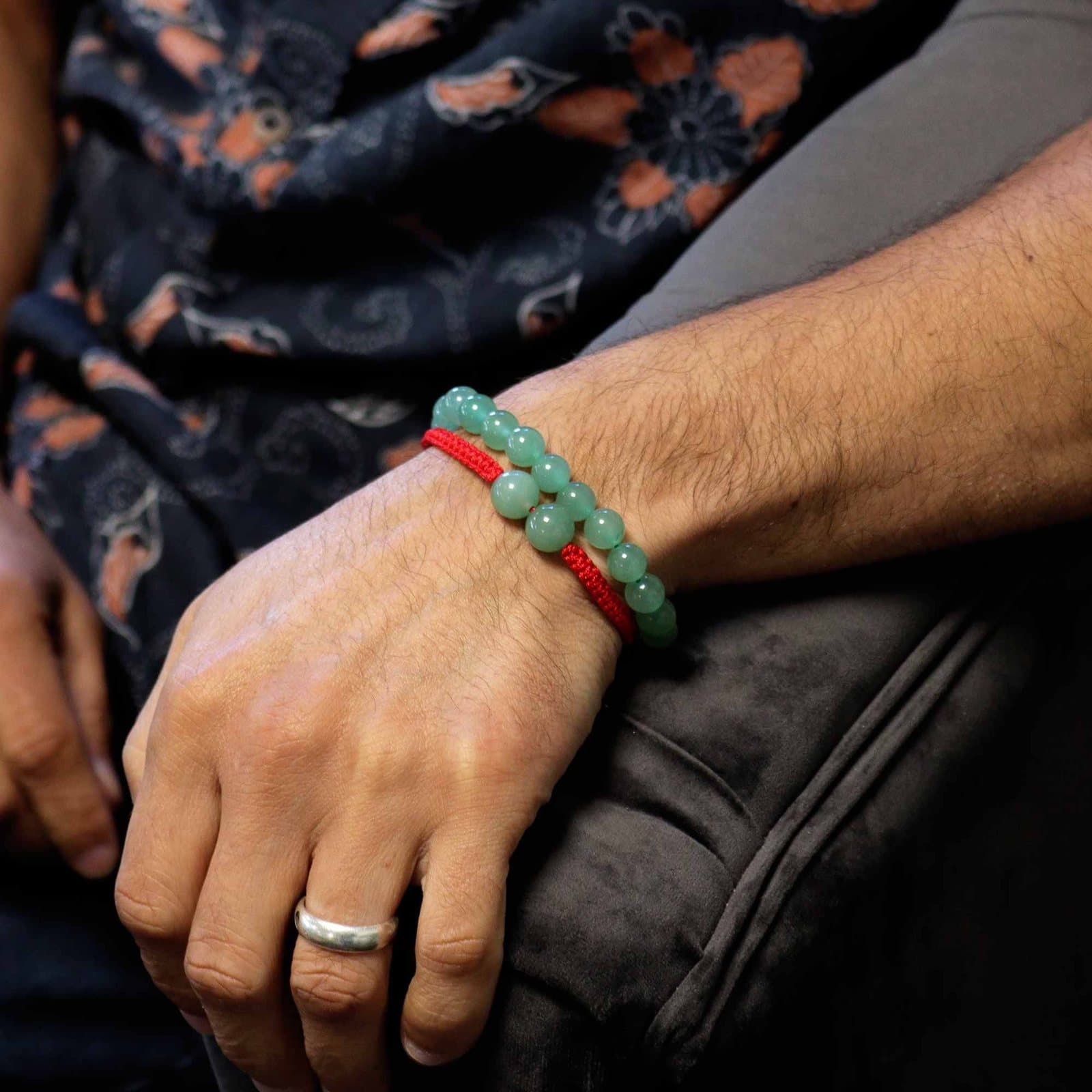 Jade gemstone bracelet strung on cotton string