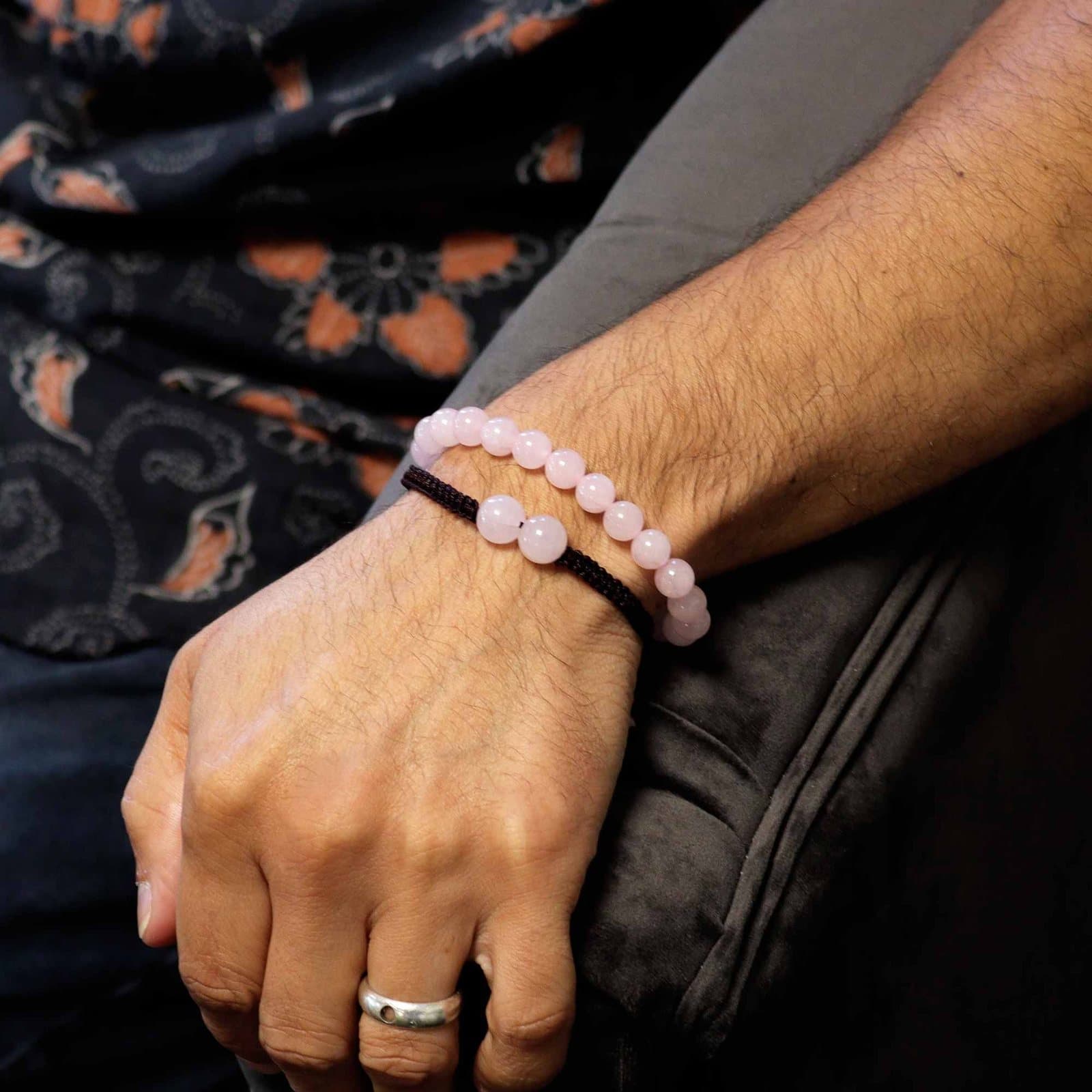 Rose quartz bead bracelet on a coloured string