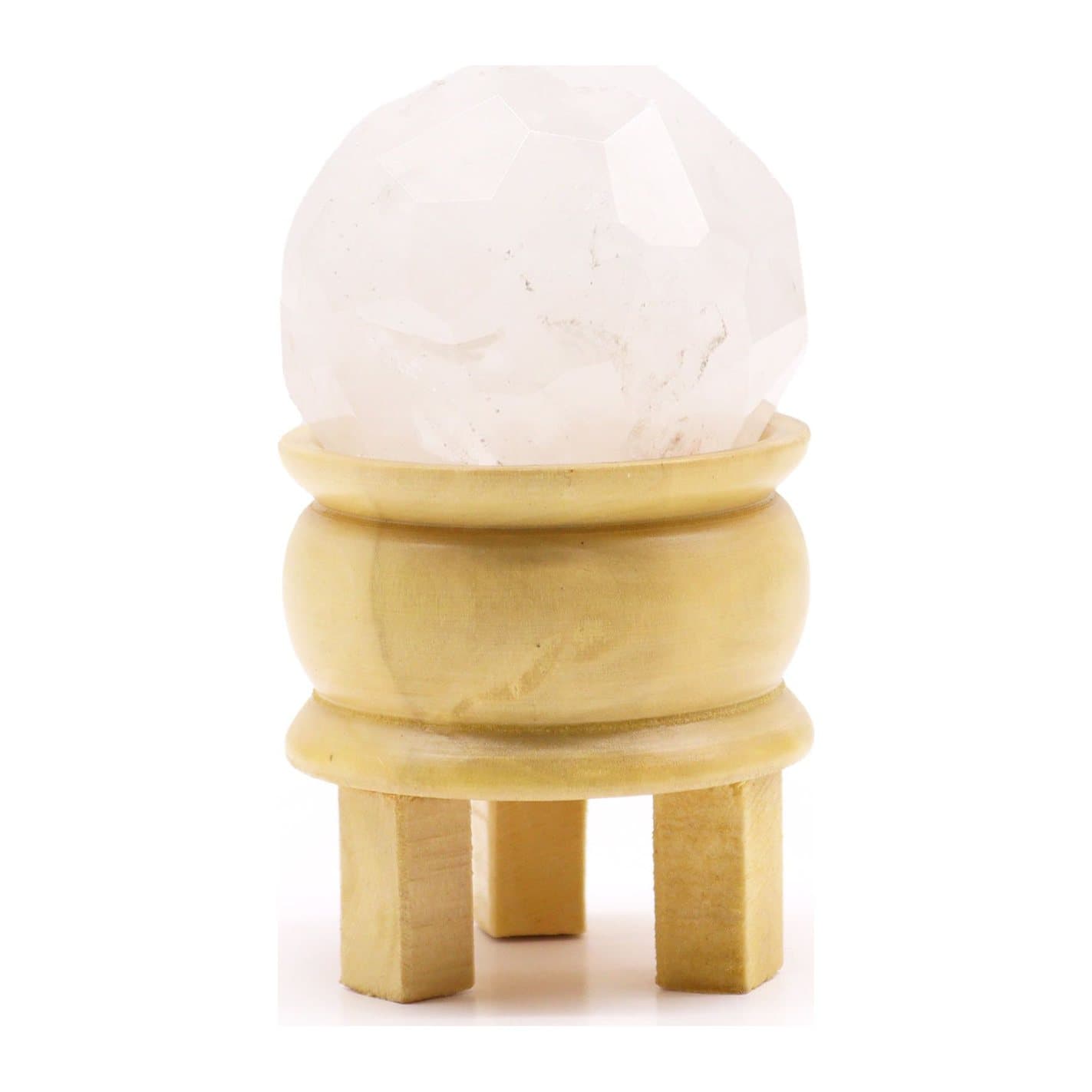 Faceted rock quartz crystal ball on a light brown wooden stand