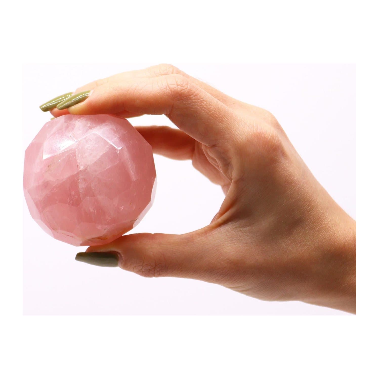 Faceted rose quartz ball on a light brown wooden stand