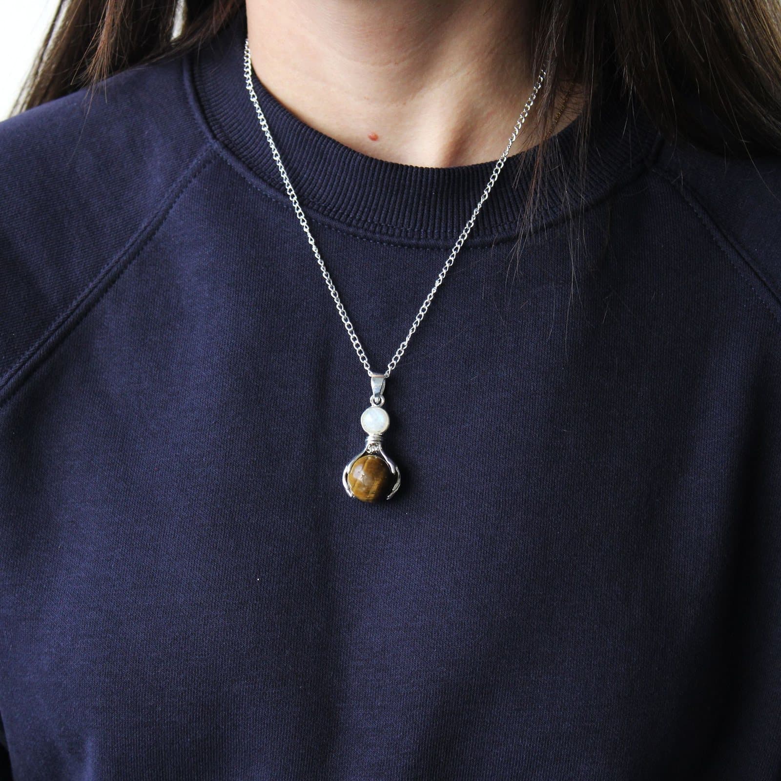 Tiger eye gemstone pendant on a silver-plated chain
