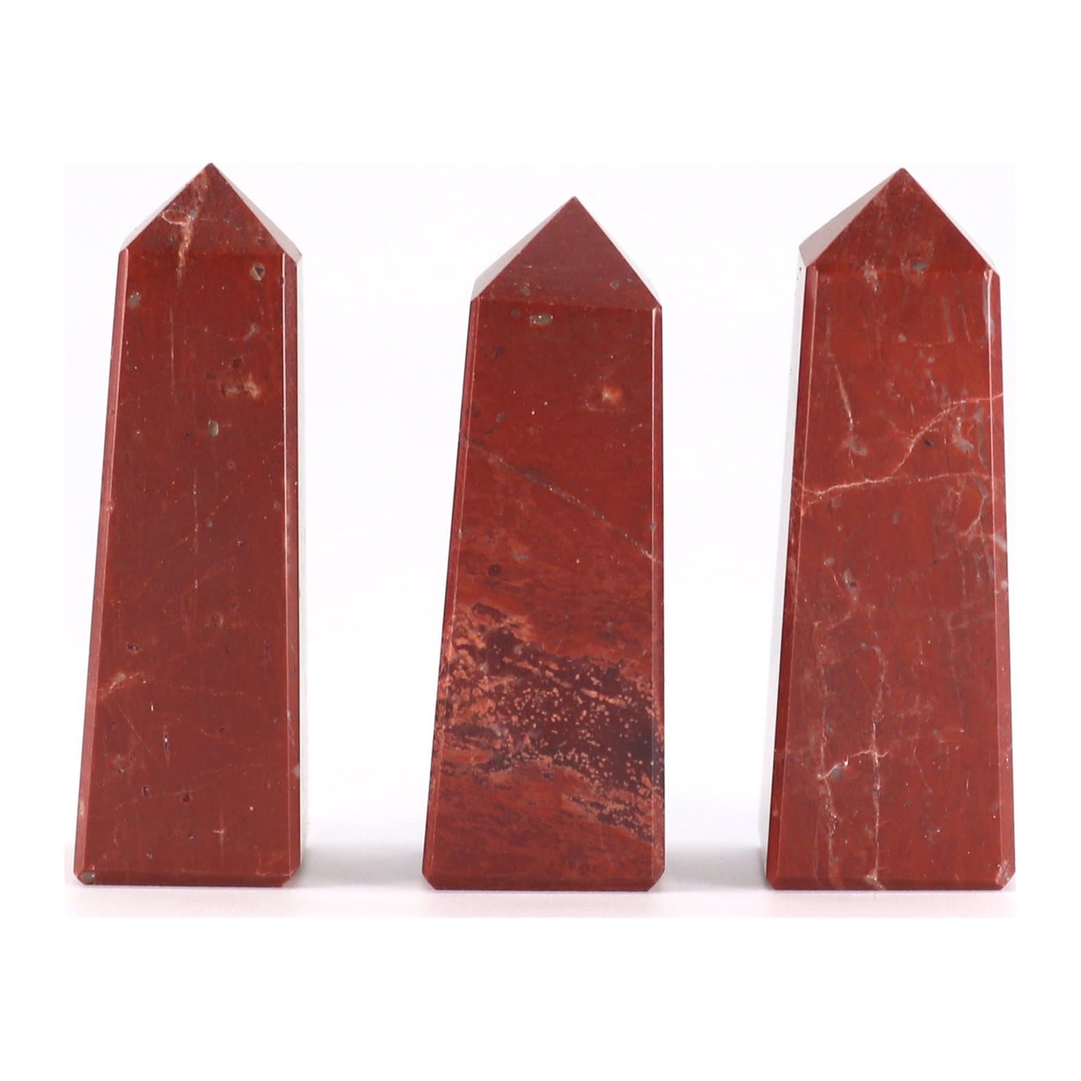 Polished red jasper obelisk point in warm earthy tones