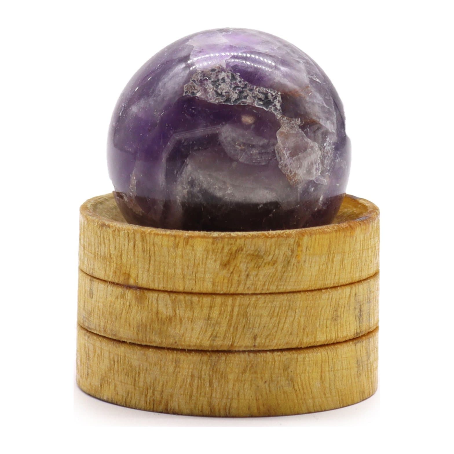 Purple African amethyst crystal sphere resting on a stand