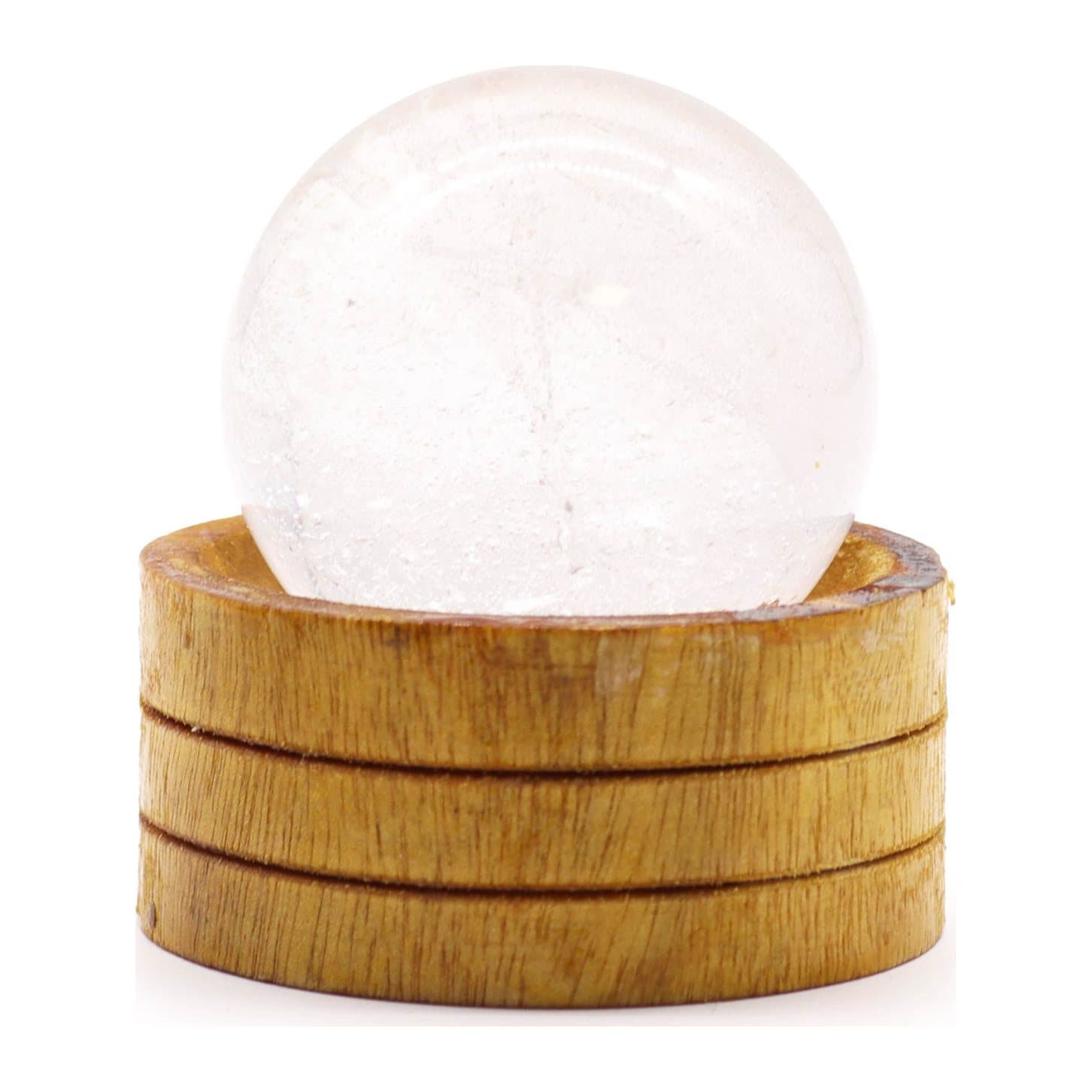 Clear quartz crystal sphere resting on a stand