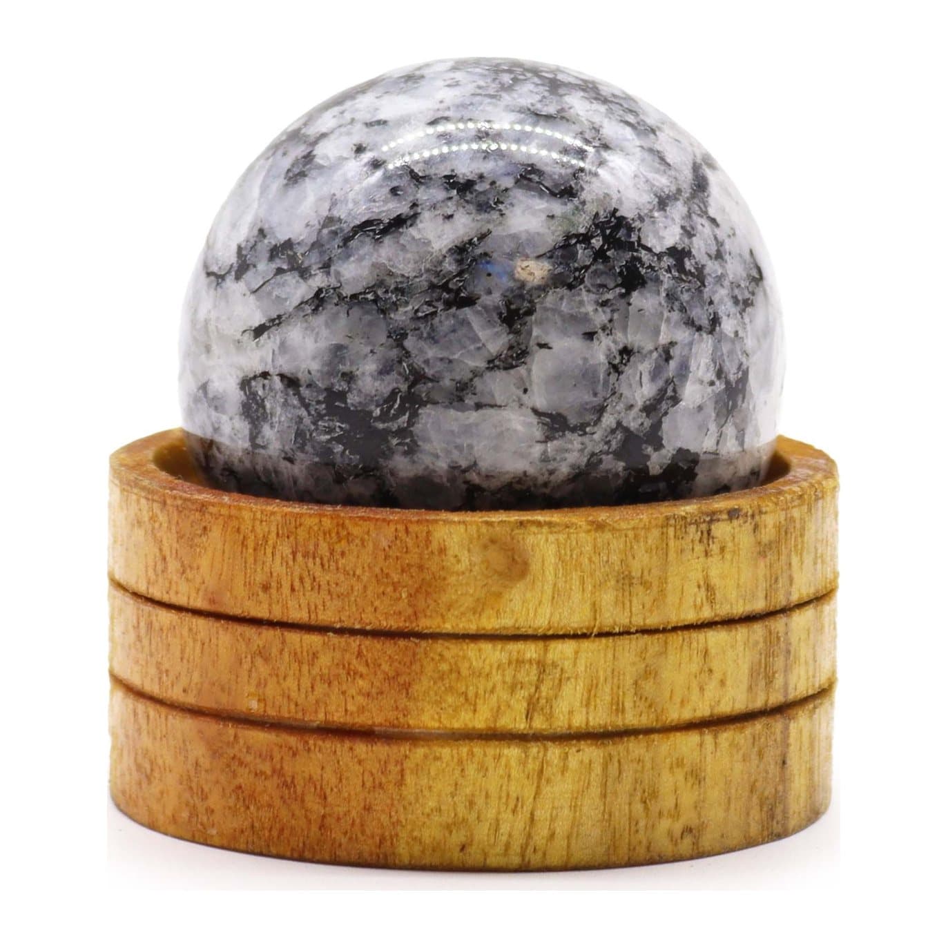Indian moonstone crystal sphere sitting on a stand