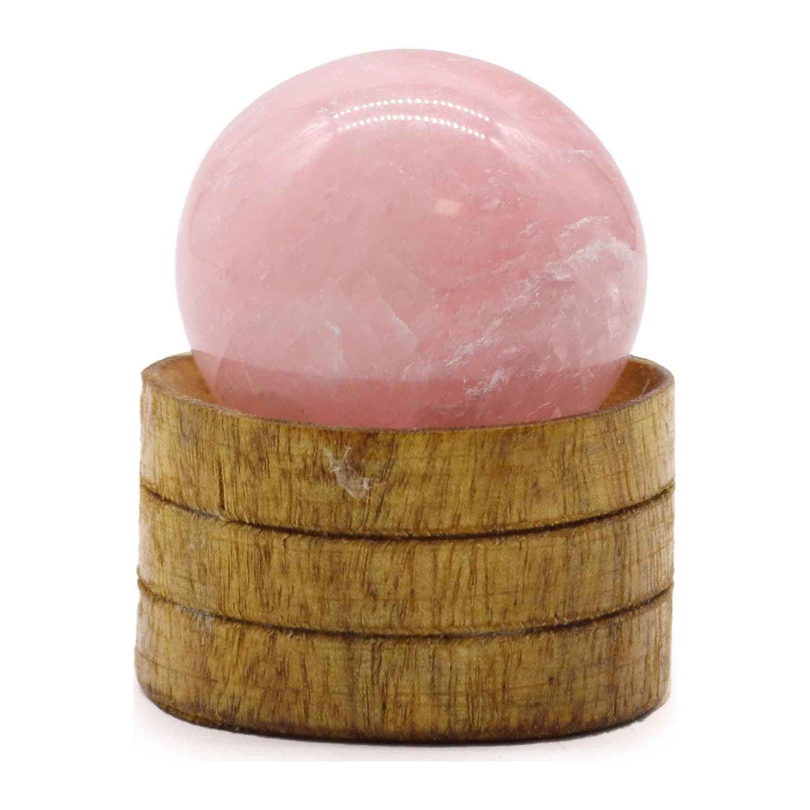 Rose quartz crystal sphere resting on a stand