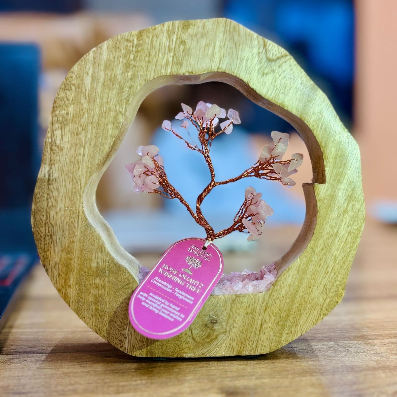 Rose quartz gemstone tree wired inside a mango wood ring