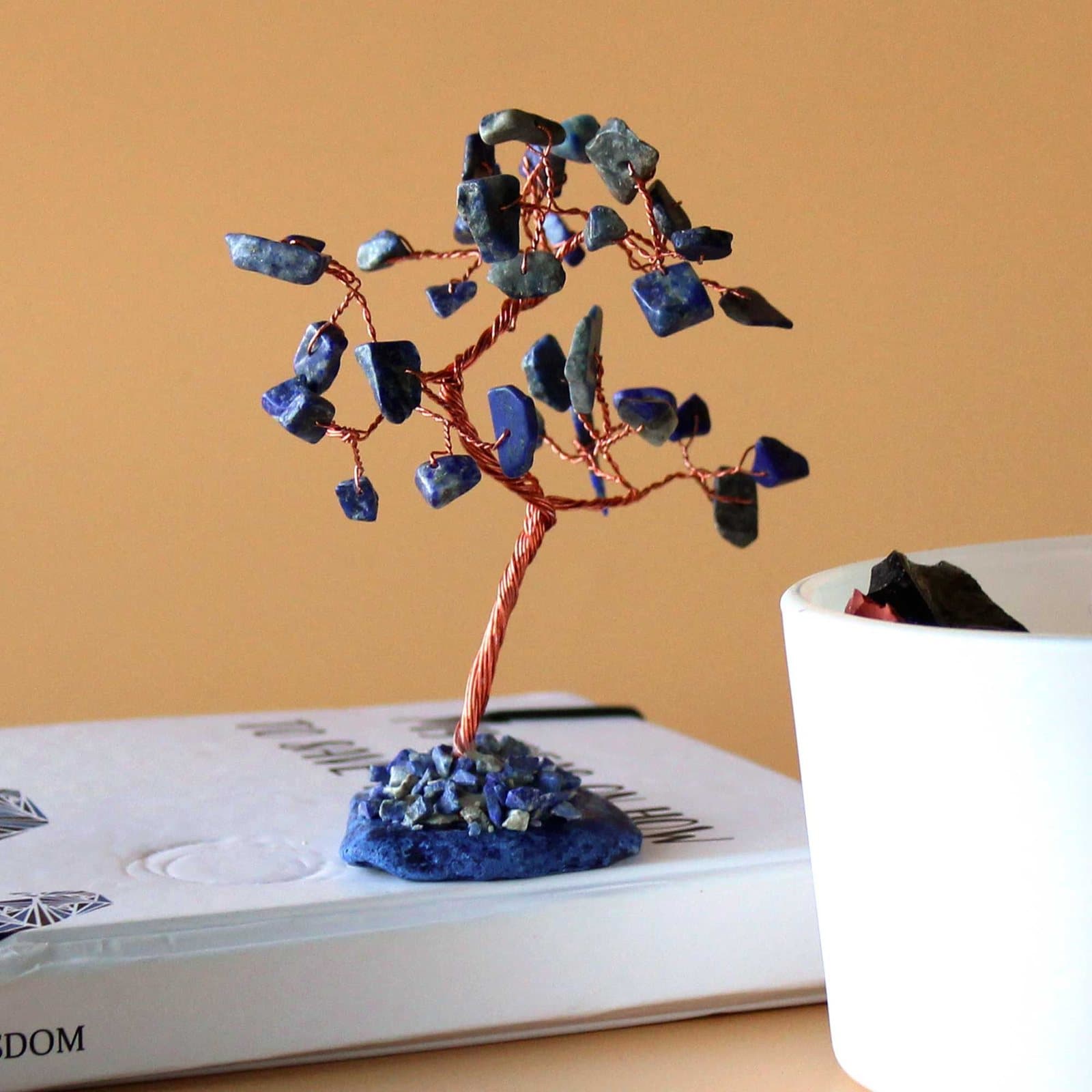 Gemstone tree of sodalite stones on a blue agate base