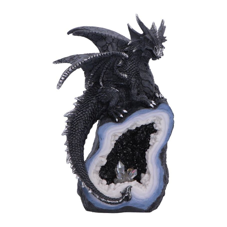 Black dragon figurine perched on a geode crystal
