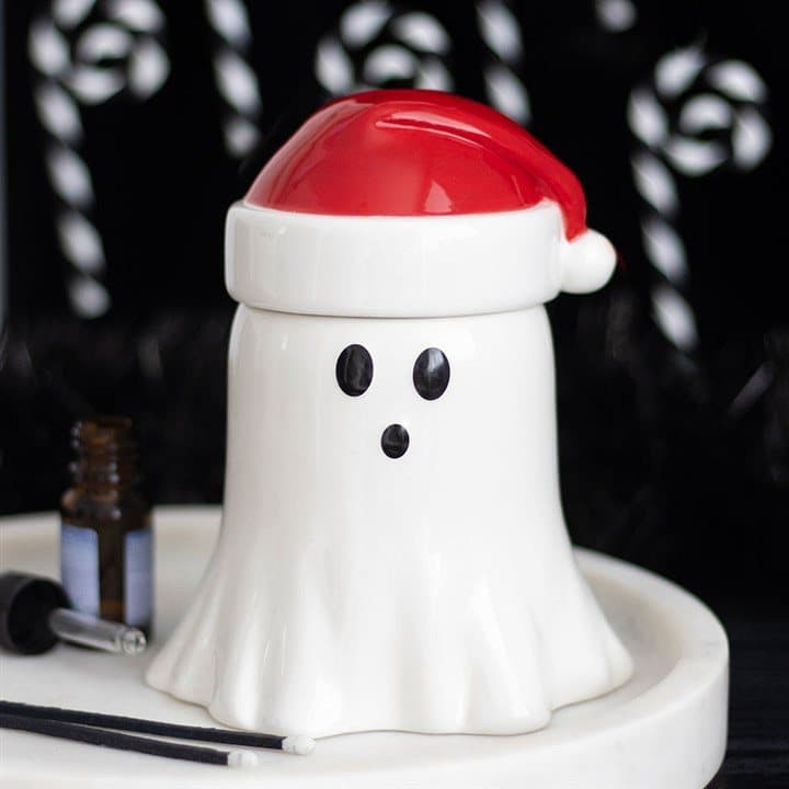 Ceramic ghost-shaped oil burner with a Santa hat lid