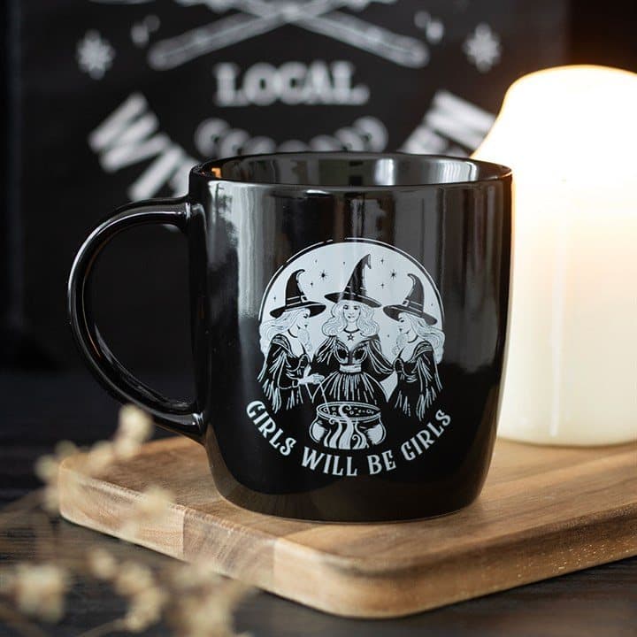 Black ceramic mug with three witches and Girls Will Be Girls text