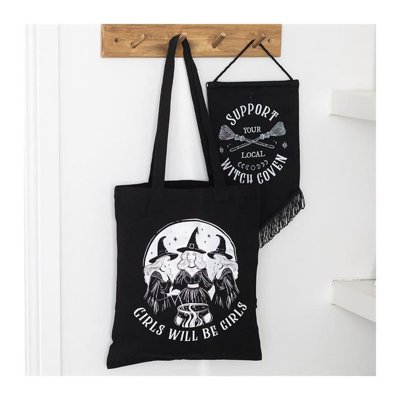 Black tote bag with three spell-casting witches and Girls Will Be Girls text